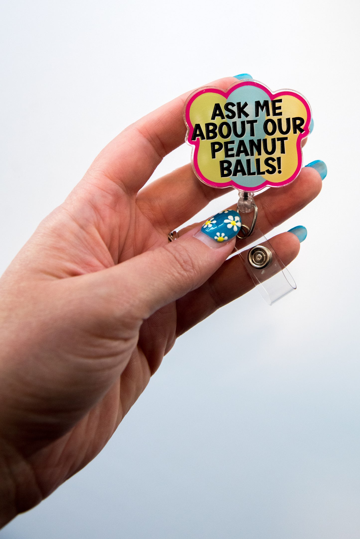 Ask Me About Our Peanut Balls Badge Reel